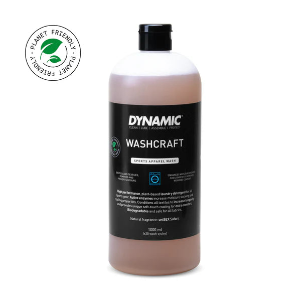 Bottle of Dynamic Washcraft laundry detergent with a planet-friendly logo on a white background