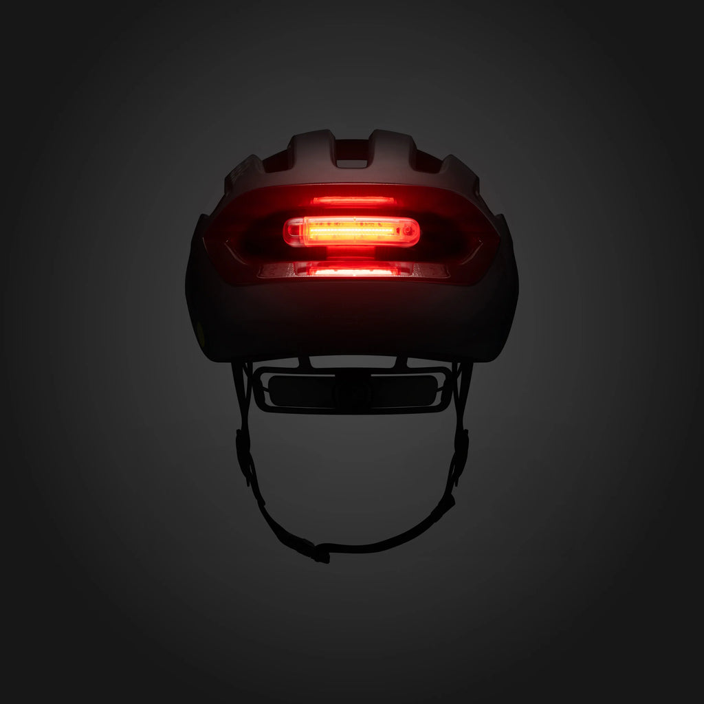Helmet with a red light on a dark background