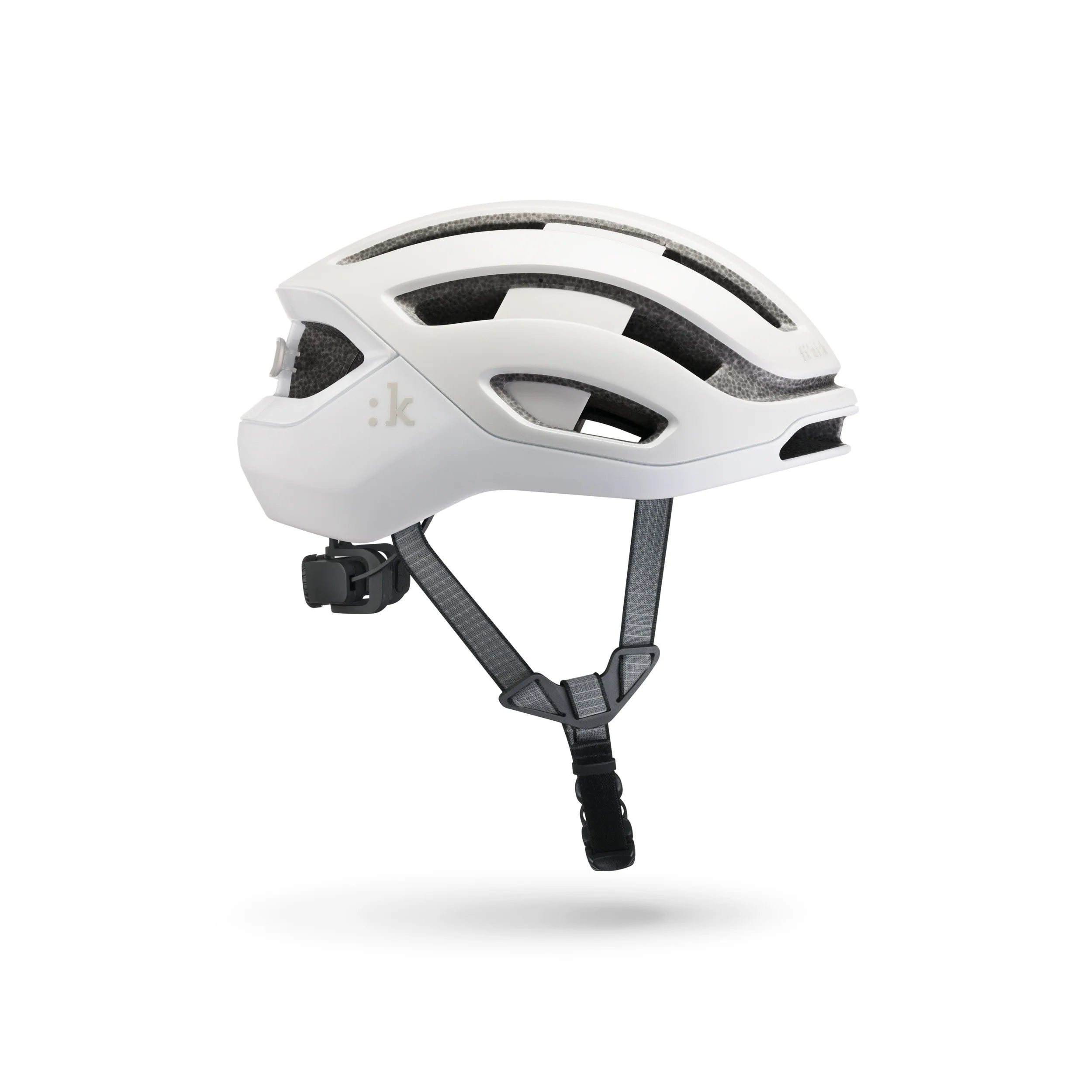 White helmet with black straps on a white background